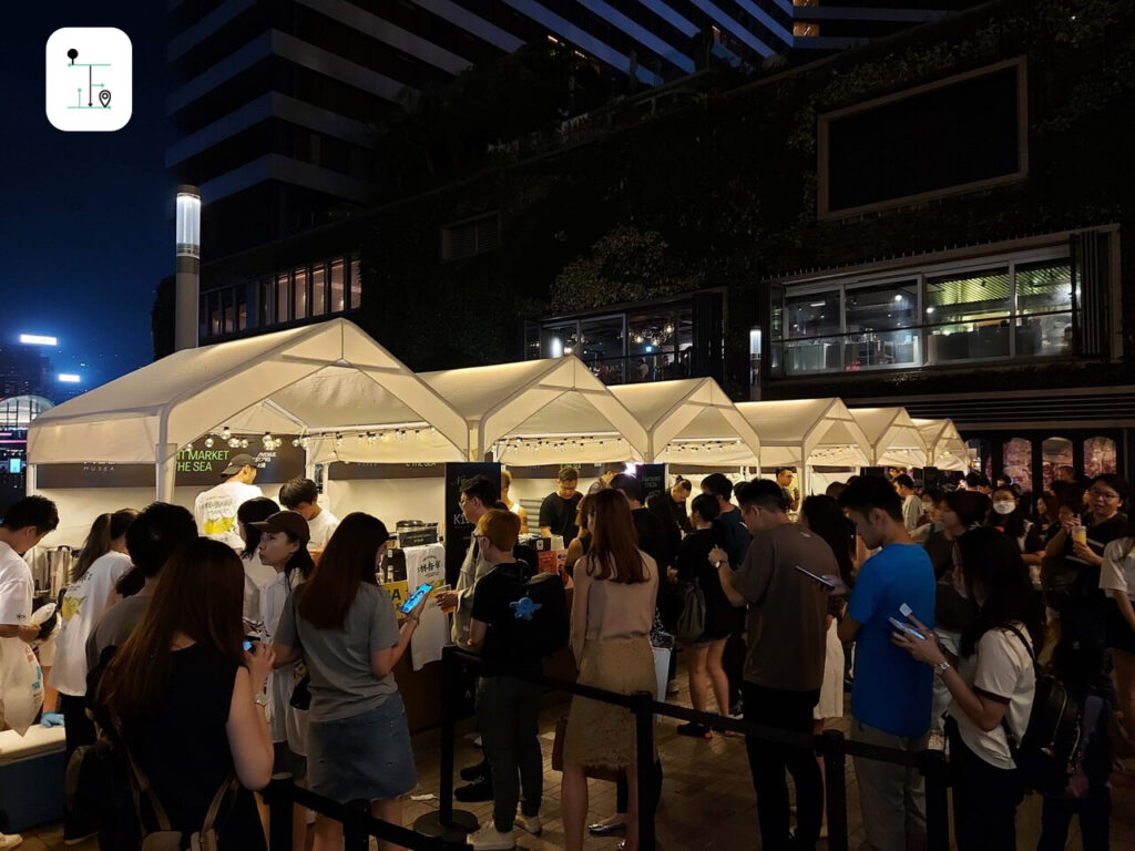 crowded in front of the booths of the Night Market by the Sea