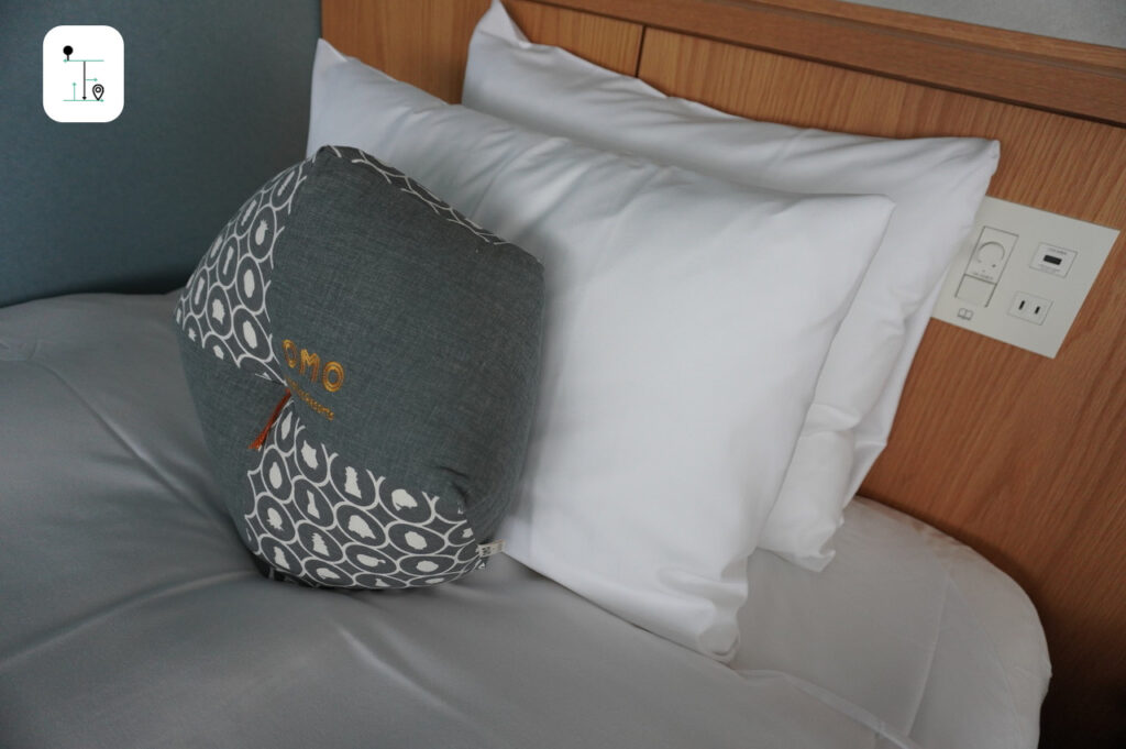 soft pillow and cushion on bed in the deluxe room