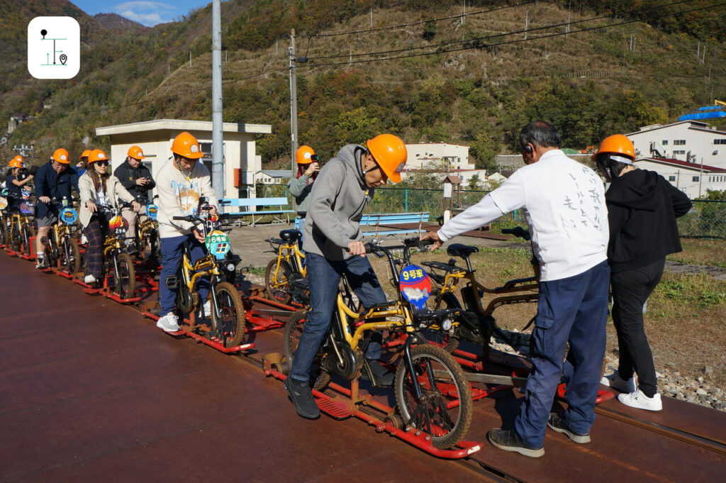 the staff is checking the railbike to ensure the safety.