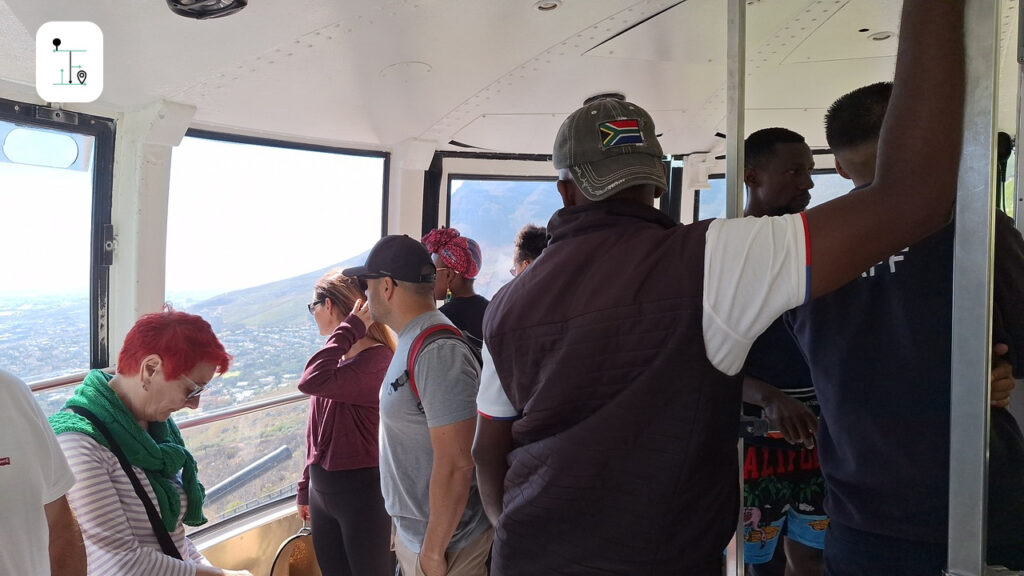 The cable car is full of visitors.