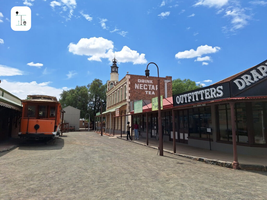 an old tram parked on the old town street.