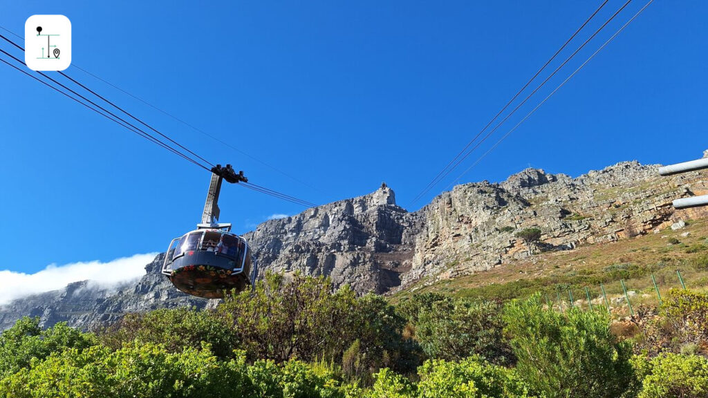 The cable car is rotating up to the top of the Table Mountain.