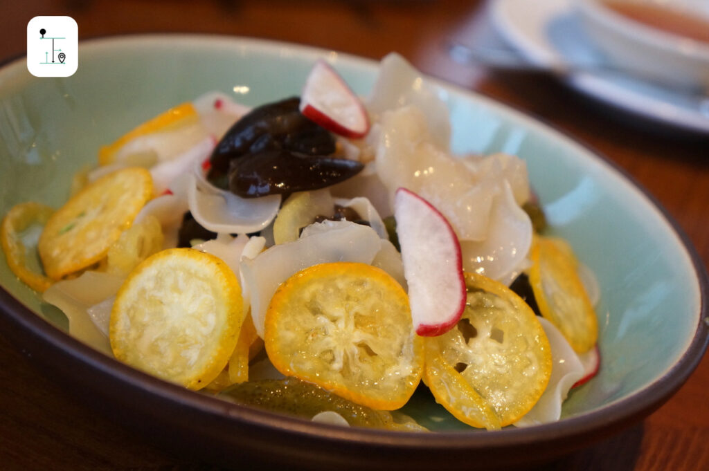 sliced kumquat with preserved little cucumber, fungus and little radish