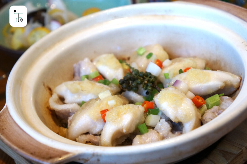 hot pot with sliced pork and chopped abalone