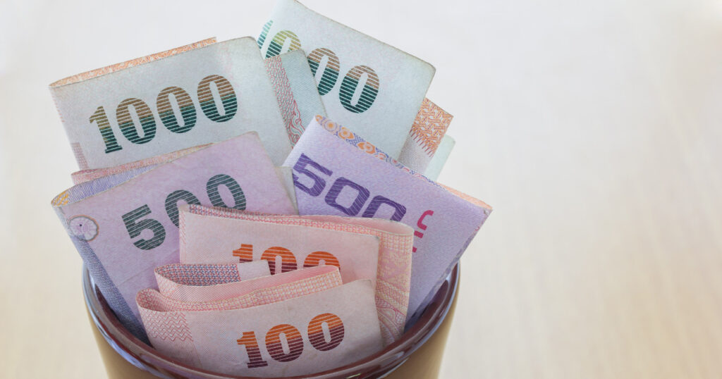different thai baht's notes are in the tip box.